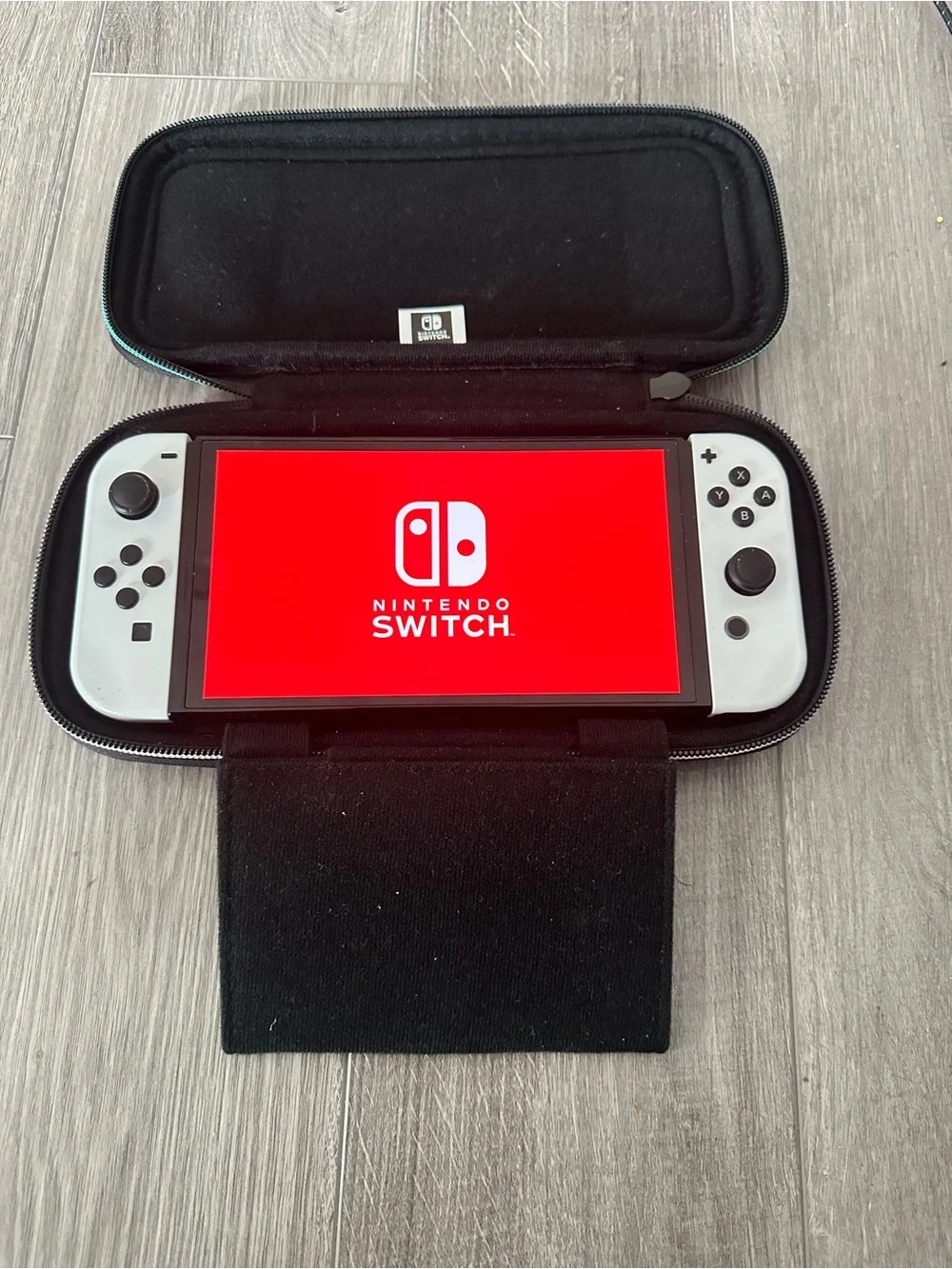 Nintendo Switch OLED Console with White Joy‑Con and Zelda Carry Case